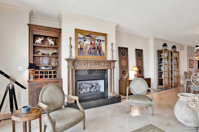 tiled living room with a textured ceiling, a tiled fireplace, and crown molding