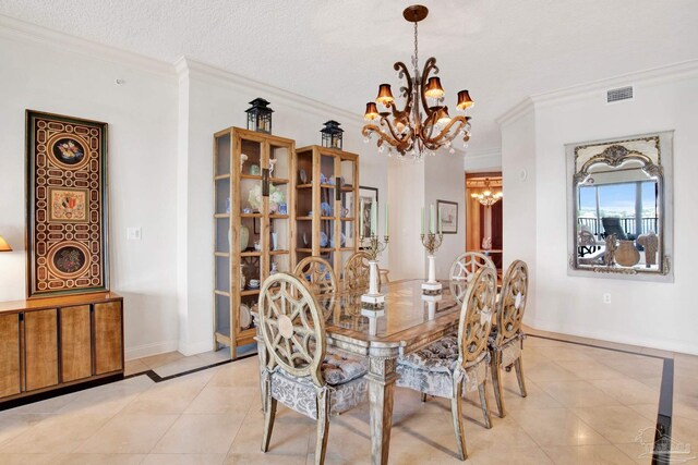 dining space featuring a notable chandelier, crown molding, light tile patterned floors, and a textured ceiling