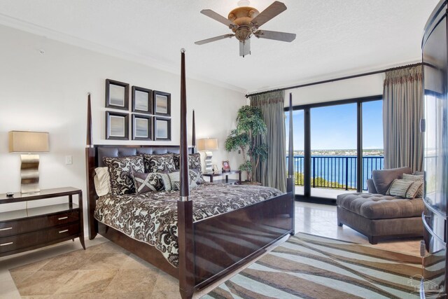 tiled bedroom with ornamental molding, a water view, ceiling fan, and access to exterior