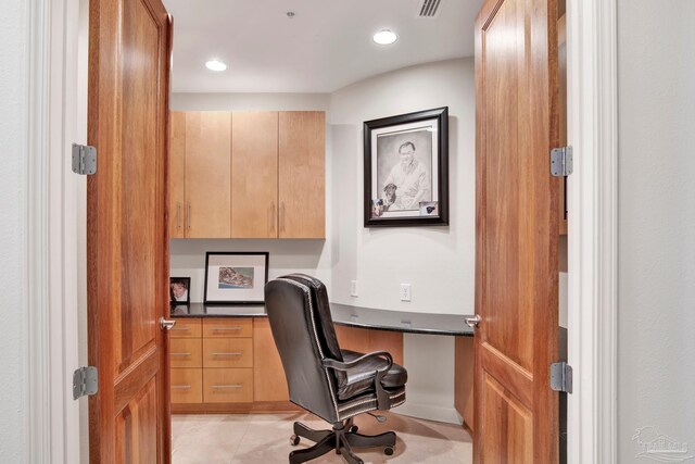 tiled office space with built in desk