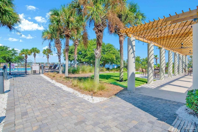 exterior space featuring fence, a gate, and a pergola