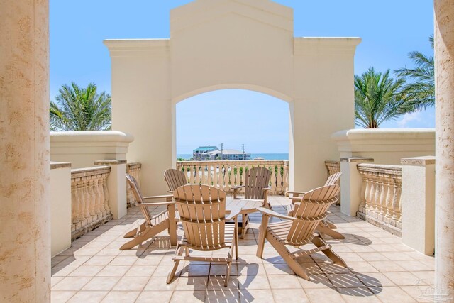 view of patio with a water view