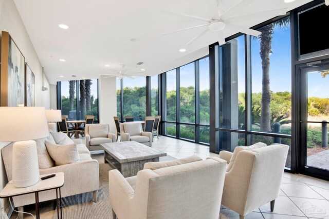 living room featuring light tile patterned flooring, ceiling fan, and floor to ceiling windows