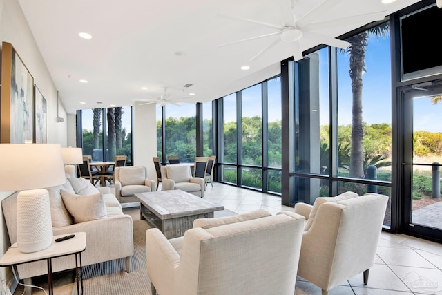 sunroom / solarium featuring ceiling fan