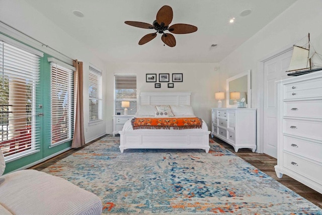 1669 Tidewater Ln, Navarre, FL 32566 - bedroom featuring access to exterior, wood finished floors, and ceiling fan
