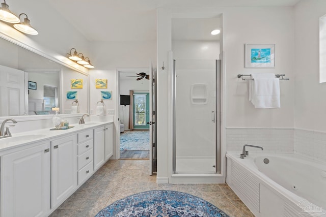 1669 Tidewater Ln, Navarre, FL 32566 - full bath featuring double vanity, a whirlpool tub, a stall shower, and a ceiling fan