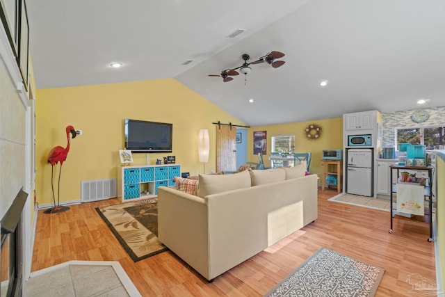 1669 Tidewater Ln, Navarre, FL 32566 - living area featuring lofted ceiling, light wood-style floors, a ceiling fan, and recessed lighting
