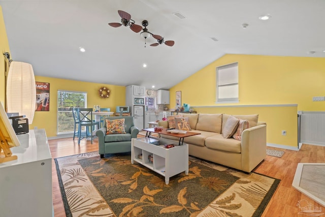 1669 Tidewater Ln, Navarre, FL 32566 - living area featuring vaulted ceiling, wood finished floors, a ceiling fan, and recessed lighting