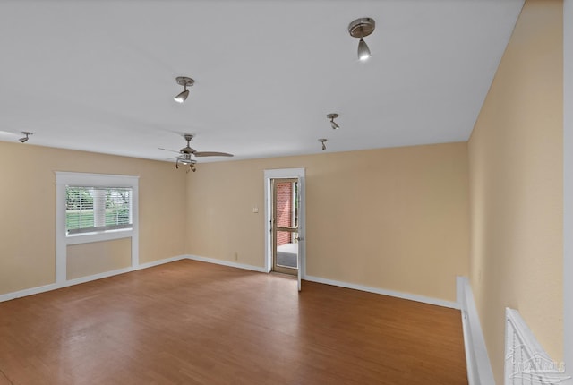 506 E Scott St, Pensacola, FL 32503 - spare room featuring baseboards, ceiling fan, and wood finished floors