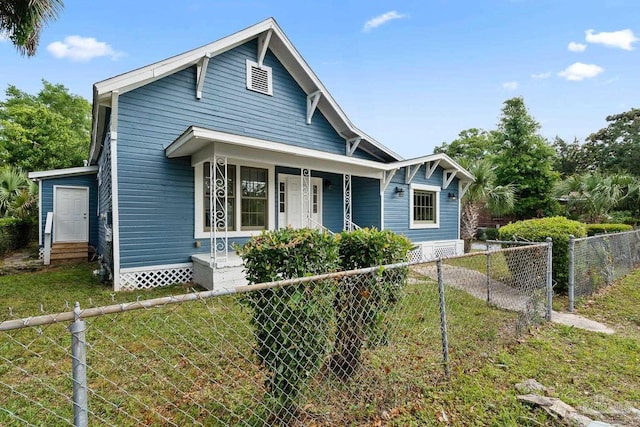 506 E Scott St, Pensacola, FL 32503 - bungalow-style home featuring fence private yard, a front lawn, entry steps, and a porch