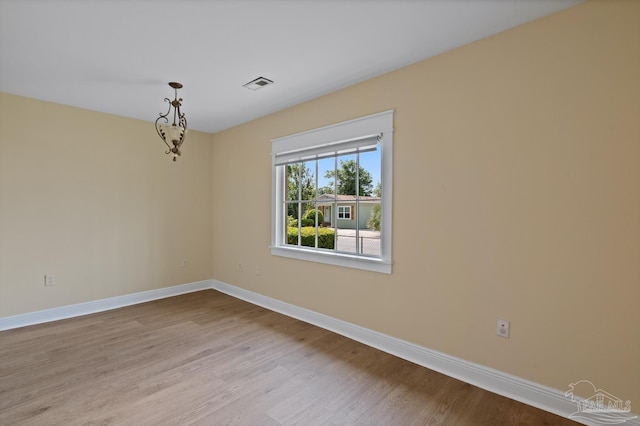 506 E Scott St, Pensacola, FL 32503 - spare room with visible vents, baseboards, and wood finished floors