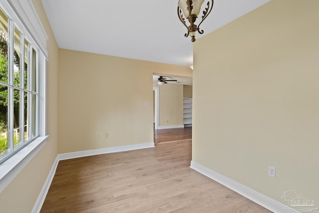 506 E Scott St, Pensacola, FL 32503 - empty room featuring a ceiling fan, baseboards, and light wood-style flooring