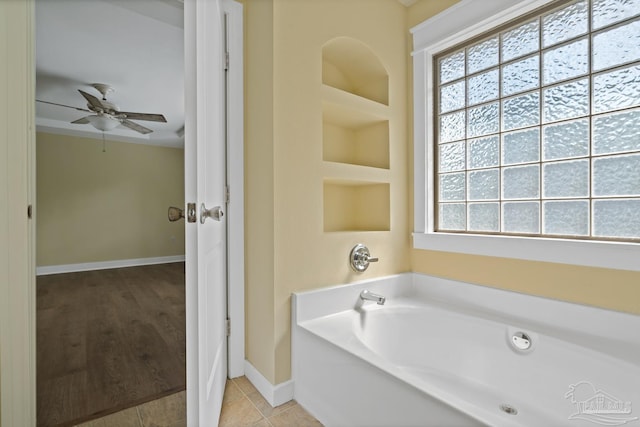 506 E Scott St, Pensacola, FL 32503 - full bathroom featuring baseboards, ceiling fan, and a garden tub