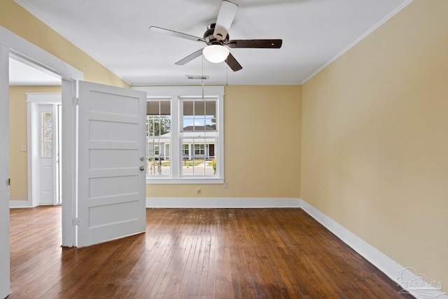 506 E Scott St, Pensacola, FL 32503 - spare room with a ceiling fan, visible vents, ornamental molding, and dark wood finished floors