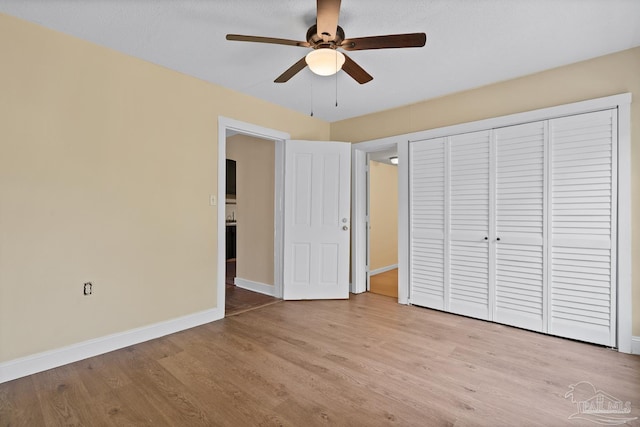 506 E Scott St, Pensacola, FL 32503 - unfurnished bedroom with light wood-style floors, baseboards, a ceiling fan, and a closet