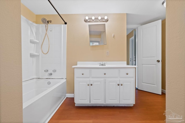 506 E Scott St, Pensacola, FL 32503 - full bath with vanity, baseboards, bathtub / shower combination, and wood finished floors