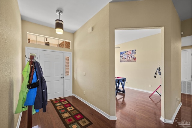 7770 Fenwick St, Navarre, FL 32566 - foyer featuring wood finished floors and a textured wall