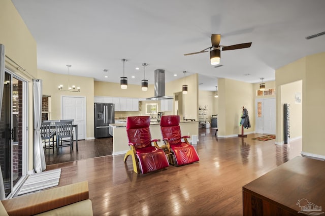 7770 Fenwick St, Navarre, FL 32566 - living area featuring ceiling fan, dark wood finished floors, recessed lighting, and a chandelier