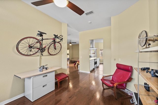 7770 Fenwick St, Navarre, FL 32566 - living area with a ceiling fan and dark wood finished floors