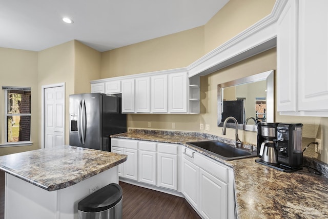 7770 Fenwick St, Navarre, FL 32566 - kitchen featuring fridge with ice dispenser, white cabinetry, a center island, dark wood-style flooring, and recessed lighting
