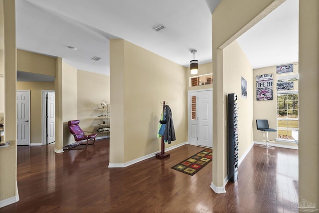 7770 Fenwick St, Navarre, FL 32566 - entryway featuring wood finished floors and baseboards