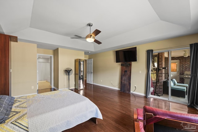 7770 Fenwick St, Navarre, FL 32566 - bedroom featuring a raised ceiling, wood finished floors, a ceiling fan, and access to exterior
