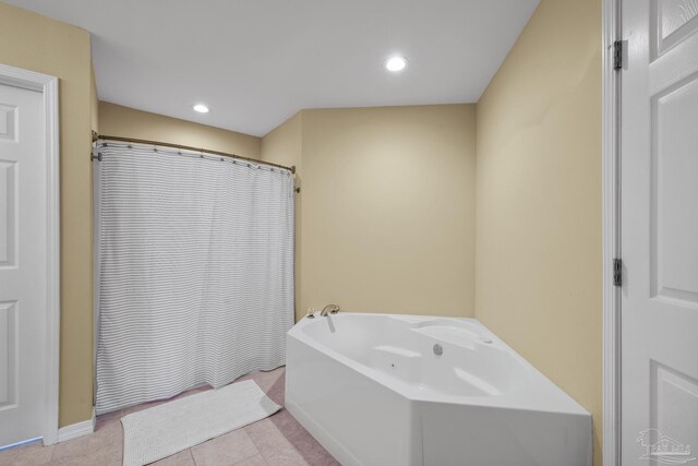 7770 Fenwick St, Navarre, FL 32566 - full bath featuring a garden tub, tile patterned floors, recessed lighting, and a shower with shower curtain