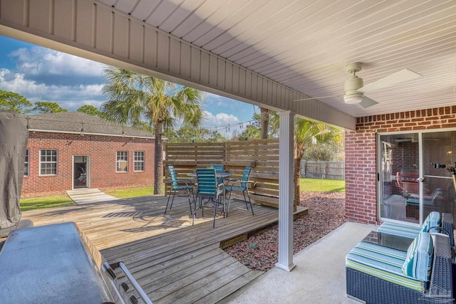 7770 Fenwick St, Navarre, FL 32566 - wooden deck with outdoor dining space and ceiling fan
