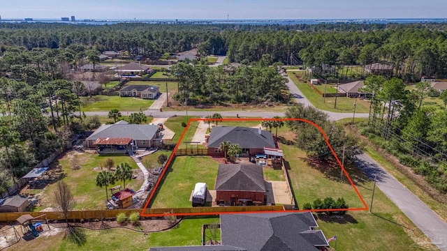 7770 Fenwick St, Navarre, FL 32566 - aerial view of residential area with property boundaries highlighted and a forest