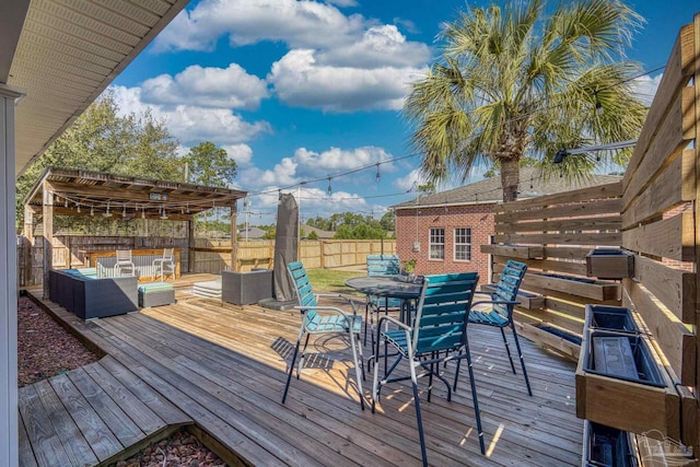 7770 Fenwick St, Navarre, FL 32566 - wooden deck featuring a fenced backyard and outdoor dining area