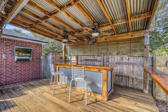 7770 Fenwick St, Navarre, FL 32566 - wooden terrace with a ceiling fan