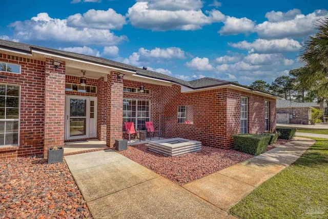 7770 Fenwick St, Navarre, FL 32566 - view of exterior entry with brick siding