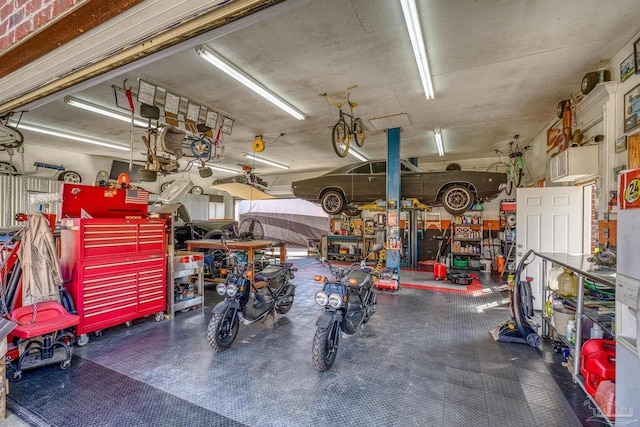 7770 Fenwick St, Navarre, FL 32566 - garage featuring a workshop area