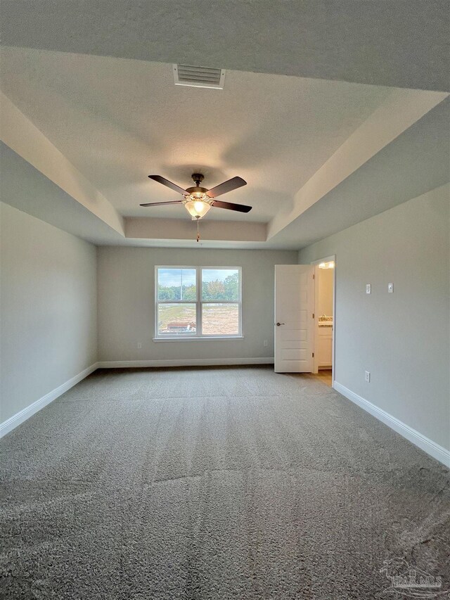 6036 Brylex Ln Unit 19A, Pensacola, FL 32526 - carpeted spare room featuring a textured ceiling, ceiling fan, and a tray ceiling