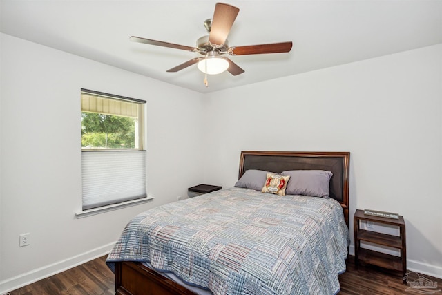 bedroom with dark wood-type flooring and ceiling fan