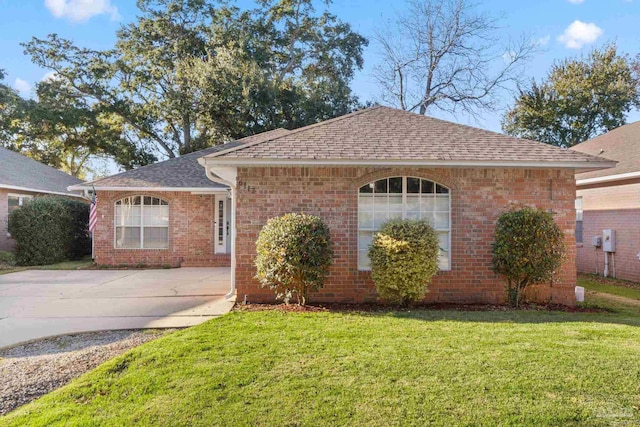 ranch-style home featuring a front yard