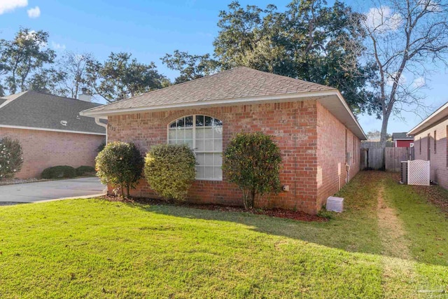 view of home's exterior featuring a yard