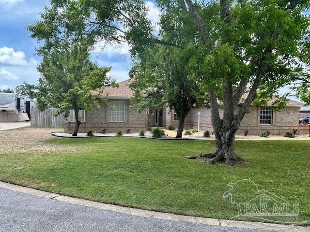 5140 Grumann Dr, Pensacola, FL 32507 - obstructed view of property with brick siding