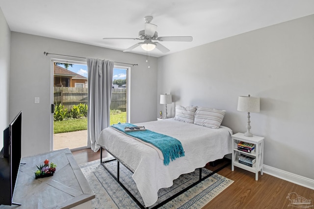 5140 Grumann Dr, Pensacola, FL 32507 - bedroom featuring access to exterior, wood finished floors, baseboards, and a ceiling fan