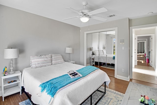 5140 Grumann Dr, Pensacola, FL 32507 - bedroom with wood finished floors, a closet, a ceiling fan, and baseboards