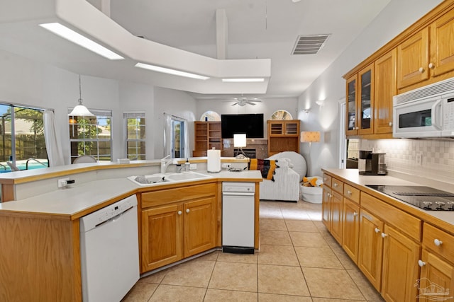 5140 Grumann Dr, Pensacola, FL 32507 - kitchen with white appliances, a sink, backsplash, light tile patterned flooring, and light countertops