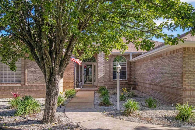 5140 Grumann Dr, Pensacola, FL 32507 - doorway to property featuring brick siding and a shingled roof