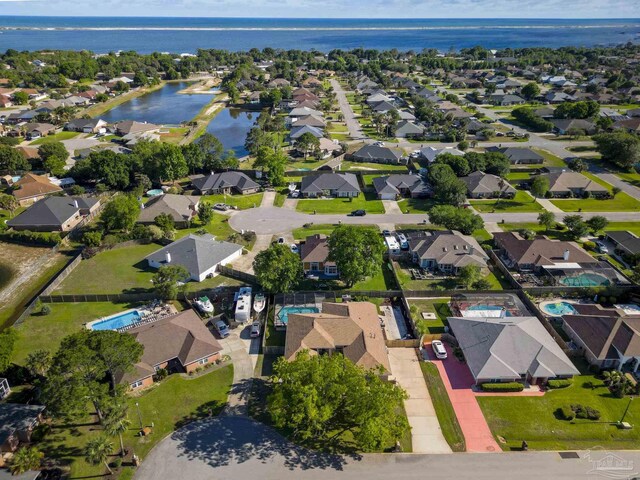 5140 Grumann Dr, Pensacola, FL 32507 - aerial overview of property's location with a large body of water and nearby suburban area