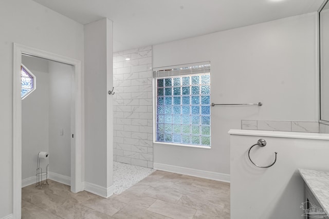 5140 Grumann Dr, Pensacola, FL 32507 - bathroom featuring a walk in shower and baseboards