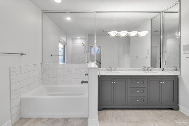5140 Grumann Dr, Pensacola, FL 32507 - full bathroom with a bath, recessed lighting, double vanity, and wood finished floors