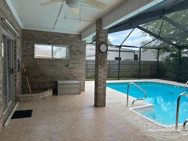 5140 Grumann Dr, Pensacola, FL 32507 - view of pool featuring a ceiling fan, a patio area, fence, and glass enclosure