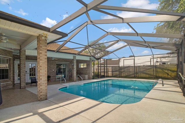 5140 Grumann Dr, Pensacola, FL 32507 - view of pool featuring a ceiling fan, a patio, glass enclosure, and fence