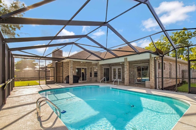 5140 Grumann Dr, Pensacola, FL 32507 - outdoor pool with french doors, a patio area, and glass enclosure