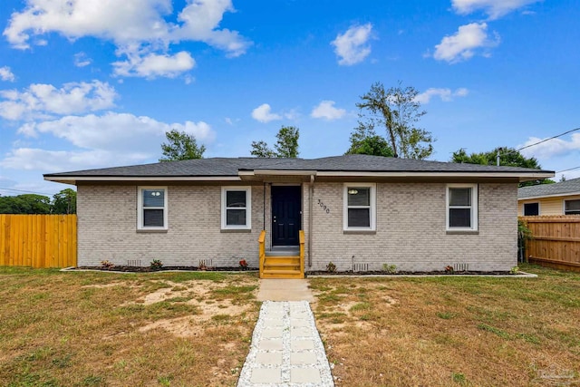 ranch-style house with a front lawn