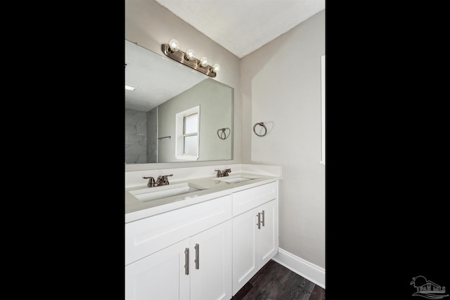 bathroom with vanity and hardwood / wood-style floors